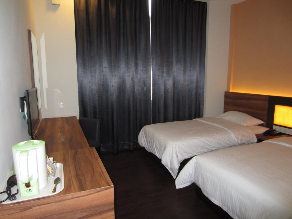 Waterfront Boutique Hotel Port Dickson Quarto foto